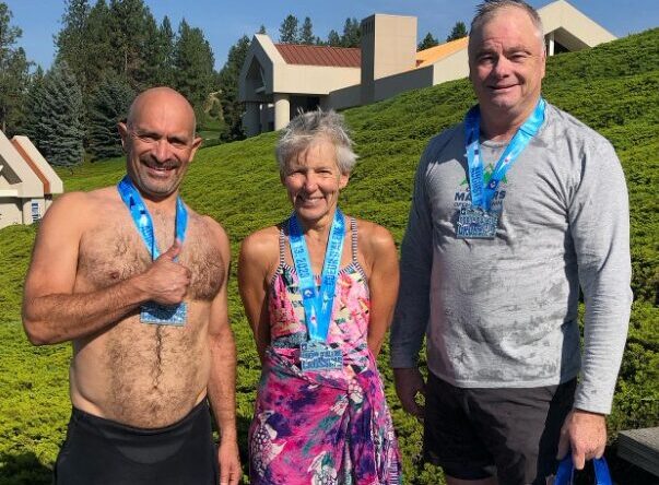 Victor with medalists after a race. Celebrating personal victories through custom running and triathlon coaching.
