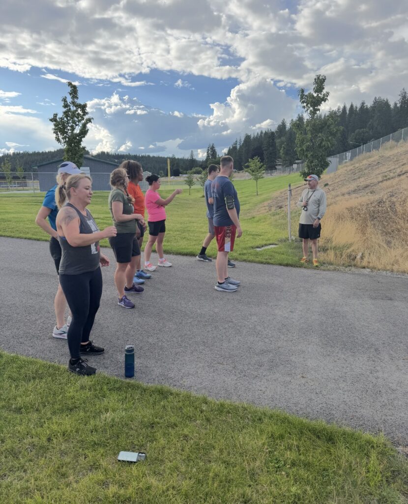 Group running together on path during triathlon training