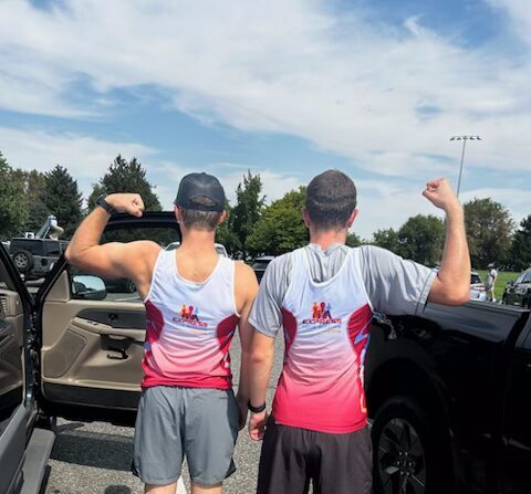Cyclists in Express Your Mission jerseys after a triathlon race