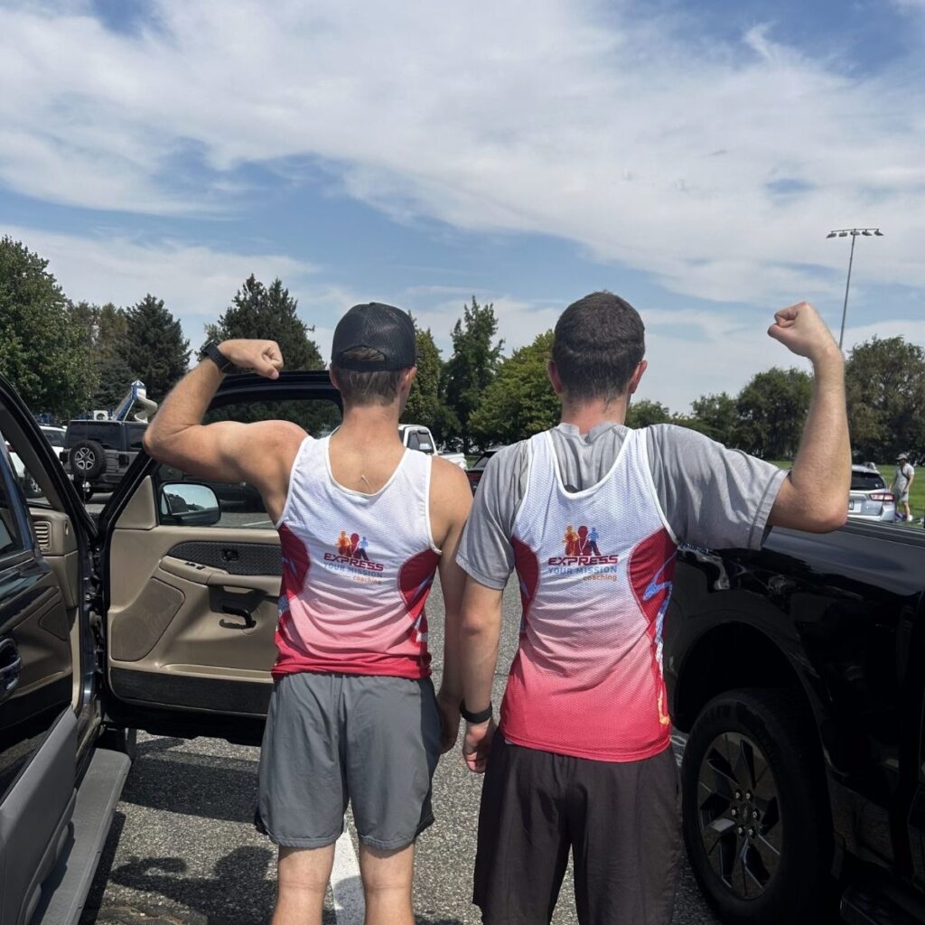 Cyclists in Express Your Mission jerseys after a triathlon race