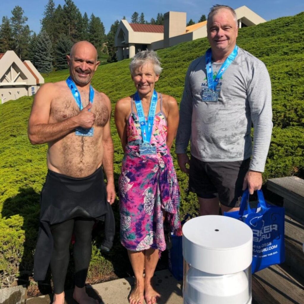 Victor with medalists after a race. Celebrating personal victories through custom running and triathlon coaching.