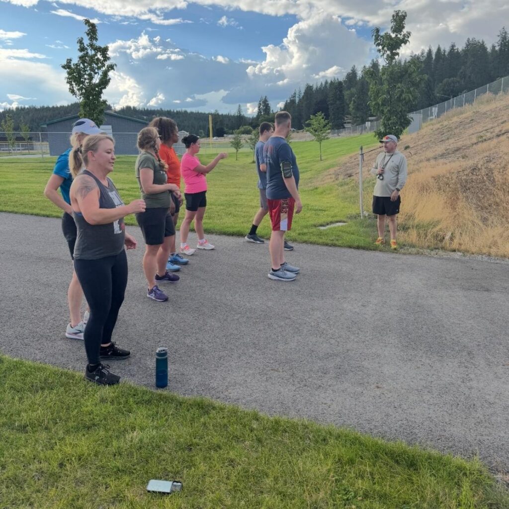 Group running together on path during triathlon training